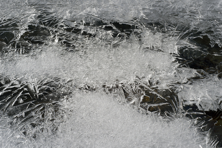 Alpine river Carpathian Ukraine famous beautiful ice and icicles. Brookvalley Manyavka near the village Manyava in January and February looks like a house of Santa Claus at Christmas and New Yearの写真素材