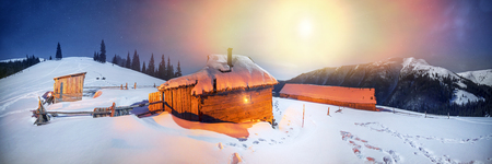 Wild Carpathian unique hrebet- Montenegro, on the background of a powerful lantern lit shelter herders of sheep and cows in the winter no one lives and spend the night only travelers and hunters.の写真素材