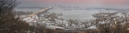 Kiev, Ukraine-January 20, 2015: View a night of the Botanical Garden of the bridge Paton and promenade, by which citizens are ferried in a residential area on the left bank of the center of the capital of Ukraine. The view from the highest mountainのeditorial素材