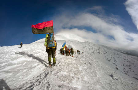 Rakhov, Ukraine-January 8, 2015: Climbing the Christmas Ukrainian climbers on the top of the main country - Goverla on the Montenegrin ridge, with the state and the flag and the Rebel Army Roman Shukhevych and Stepan Banderaのeditorial素材