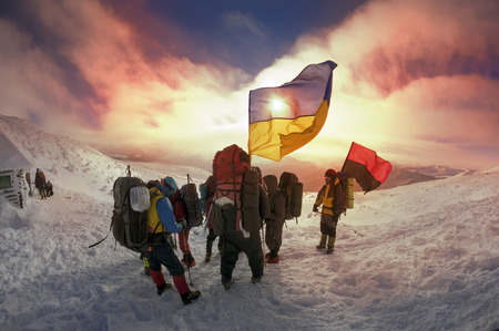 Carpathian Mountains, Ukraine-January 8, 2015: Climbing the Christmas Ukrainian climbers on the top of the main country - Goverla on the Montenegrin ridge, with the state and the flag and the Rebel Army Roman Shukhevych and Stepan Banderaのeditorial素材