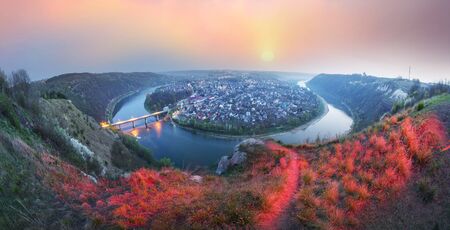 Zaleshiki town on the bank of the Dniester River on the scenic bend of the night when the beautiful light houses and the bridge turns into a fairy tale landscape. As the canyon in Colorado, USAの写真素材