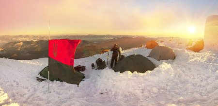 Climbers tradition to celebrate the New Year holiday on the highest peak of Ukraine - Goverla, Montenegrin Mountains. Severe frost danger destruction wind- climbing camp January 1, 2016の写真素材