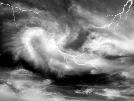 Dragon, dinosaur, like a fantasy in the form of bright clouds scenic natural phenomena in a cloud of black and white shades - clouds after rain and bad weather in the storm with lightningの写真素材
