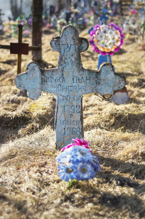 Ukraine, Torun - May 24, 2015: old village cemetery near the church in the mountains has interesting ancient monuments of Christian culture beautiful art naive believers Carpathian Ukraineのeditorial素材