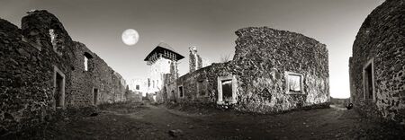 Ancient Nevytsky Castle ruined ruins on top of a mountain with an interesting original lighting attracts tourists in the West of Ukraine, Retro classic black and white tonality of silver photographyの写真素材