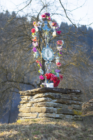 The old village cemetery near the church in the mountains has interesting ancient monuments of Christian culture beautiful art naive believers Carpathian Ukraine Eastern Europeの写真素材