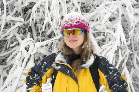 Powerful snow storm cyclone swept Europe Photo of a young girl walking and playing snowballs in the...