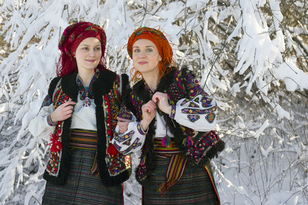 Young Ukrainian girl in an old picturesque present authentic national costume Ukrainian highlanders Gutsuliya on the background of wild nature Huzulschyna in Carpathians, Ukraineの写真素材