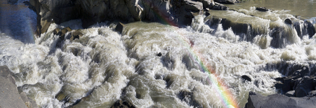 Yaremche waterfall after heavy rains the water rushing fast rapids between the rocks and stones. This tourist attraction famous resort city in western Ukraine in the Carpathian mountainsの写真素材