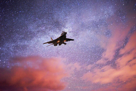 Soviet fighter against the background of the Galaxy. Starry sky above the earth scenic natural...