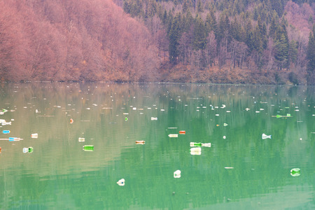 poor culture of consumption to achieve the progress of modern civilization gives a negative impact on the surrounding nature. Ecological catastrophe in the background of Carpathiansの写真素材