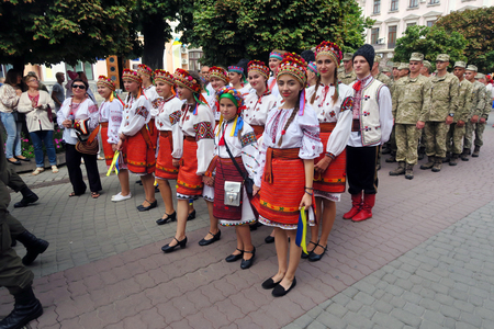 Ukraine, Ivano-Frankivsk - August 24, 2017: Independence Day is a state holiday of a sovereign European country. Citizens in traditional national costumes walk around the square the streetのeditorial素材