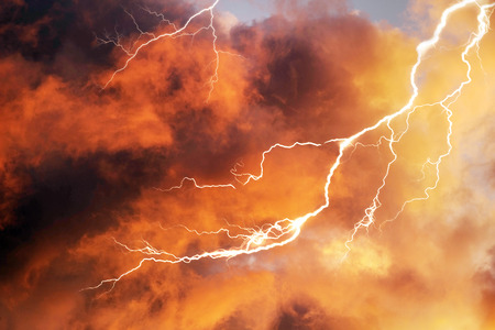 Beautiful clouds scenic natural phenomena in a cloud of colorful picturesque shades and dazzling colors - clouds after rain and bad weather in the storm with lightning over the mountainsの写真素材