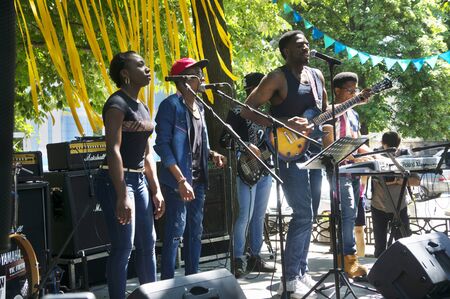 Ukraine, Ivano-Frankivsk, May 20, 2017: Concert on a free music festival performed by a black African-American rock music band, national songs and American Europeanのeditorial素材