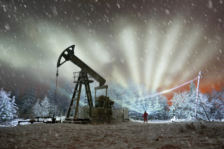 Day and night, in a severe frost and a snowstorm, a snowstorm in winter in Ukraine electric mountain pumps oil pump oil gas is a valuable raw material for energy  chemical industryの写真素材