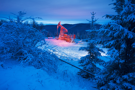 Day and night, in a severe frost and a snowstorm, a snowstorm in winter in Ukraine electric mountain pumps oil pump oil gas is a valuable raw material for energy 
 chemical industry
の写真素材
