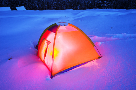 Houses of shepherds in the Carpathians, Ukraine, the trek in winter gives special extreme sensations of nature on top at night against the backdrop of the high ridge of Chernogory Goverlaの写真素材