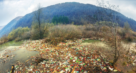 poor culture of consumption to achieve the progress of modern civilization gives a negative impact on the surrounding nature. Ecological catastrophe in the background of Carpathiansの写真素材