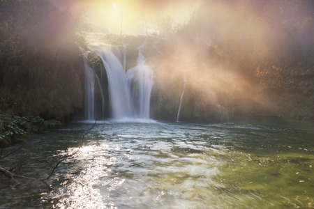 Plitvice Waterfalls in Croatia is one of the famous famous places in Europe, very beautiful. The jets of water on the background of autumn forests at sunrise are very picturesqueの写真素材