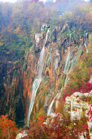 Plitvice Waterfalls in Croatia is one of the famous famous places in Europe, very beautiful. The jets of water on the background of autumn forests at sunrise are very picturesqueの写真素材