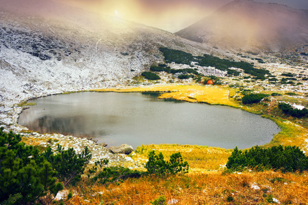 Lake Nesamovite ( Nesamovitoe) under the mountain Turkul in Chernogora Ukraine during a snowstorm in...