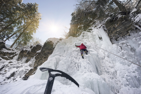 training of athletes on the frozen famous Manyavsky Falls in Manyava - Ukraine, Carpathians before going to the Alps on a glacier expedition to the glaciersの写真素材