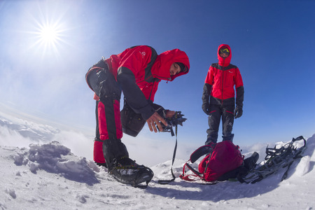 Ukraine, Verkhovyna, March 4, 2018: A rescue squad of European climbers is training in rescuing the victims on ice rocks during a foggy storm on the Black Mountain in the Carpathiansのeditorial素材