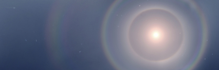 Halo usually appears around the sun and moon. They are caused mainly by ice crystals in cirrus...