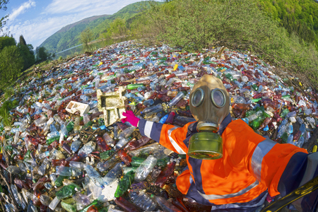 Pollution of household waste of clean mountain rivers in the Carpathians Ukraine is a huge problem for people. Special workers collect garbage, as a symbol of saving the planet Earthのeditorial素材