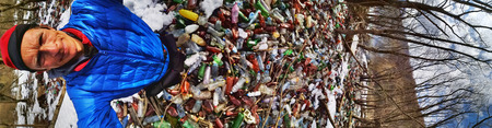 Ukraine, Kolochava, March 21, 2019: A tourist photographed with a mobile phone Xiaomi a panorama of...