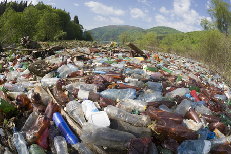 Pollution of household waste of clean mountain rivers in the Carpathians Ukraine is a huge problem for people. Special workers collect garbage, as a symbol of saving the planet Earthのeditorial素材