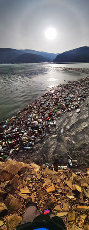 Ukraine, Kolochava, March 21, 2019: A tourist photographed with a mobile phone Xiaomi a panorama of...