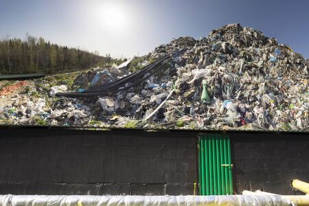 huge landfill site, a special device collects and pumps methane and other gases into storage. Gas through rubber pipes goes to tanks, alternative energyの写真素材