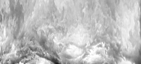 Storm clouds in the Alps after a strong thunderstorm with lightning and thunder over the tops of the ridges, with wind and rainの写真素材