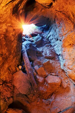 old mine, littered with a collapse. Earlier, in the depths of the alpine mountain, gold or silver...