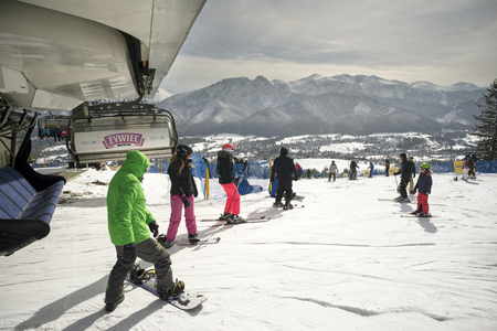 Poland, Zakopane, February 23, 2019:  People happily ski and tourist resort of the Polish city Zakopane in the Tatrasのeditorial素材