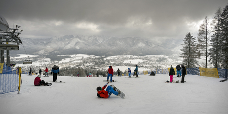 Poland, Zakopane, February 23, 2019:  People happily ski and tourist resort of the Polish city Zakopane in the Tatrasのeditorial素材