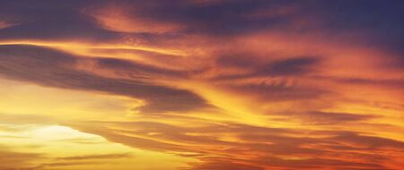 sky glows with the fiery colors of a fabulous sunset - the weather and climate change rapidly with...