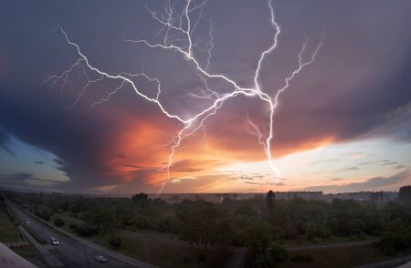 sky glows with the fiery colors of a fabulous sunset - the weather and climate change rapidly with...