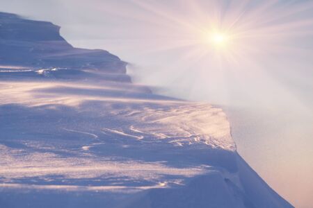 Snowy frosty peak in the Carpathians with beautiful scenery at sunset mountain range in extreme...
