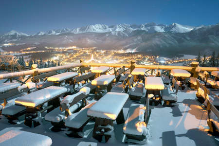 Night view of the ski and tourist resort of the Polish city of Zakopane with Mount Gubalowka and the steep slopes of the Polish Tatras. Snow Cafe Restaurantのeditorial素材