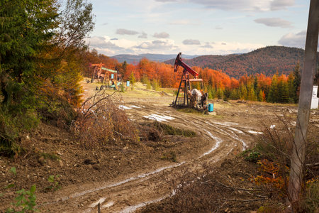Oil gas traditional old pump platform for mining production of minerals - oil and gas in the autumn...