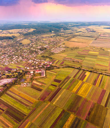 Eastern Europe, Ukraine, striped farm fields near the ancient city of Galich next to the large...