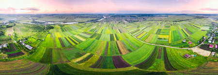 Spherical panorama 360. Eastern Europe, Ukraine, striped farm fields near the ancient city of Galich next to the large Dniester river, captured from a bird's eye view of a drone quadcopter.の写真素材