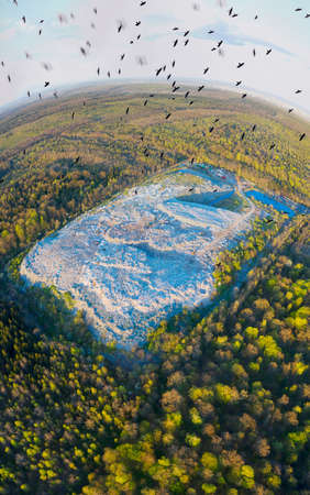 panorama of a landfill - shot from a drone quadrocopter. The symbol of a consumer society that has filled the entire planet, displacing all living things. Gypsies live here and collect plastic in bagsの写真素材