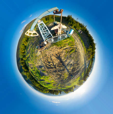 Aerial photo spherical panorama planet asteroid drone oil and gas field in Ukraine, Carpathians, Ivano-Frankivsk region, Dora village near the city of Yaremche. Oil pumps among wild forestsの写真素材