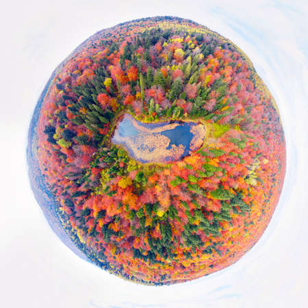 Aerial view of small lake in the autumn forest. Small lake in the autumn forest.の写真素材