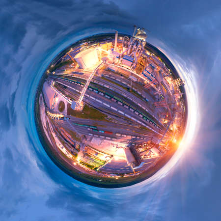 Spherical panorama symbol of a large plant, aerial photo by a drone. Large metal structures, pipes, a railway line with hundreds of wagons, bright lighting, energy and power metallurgy.の写真素材