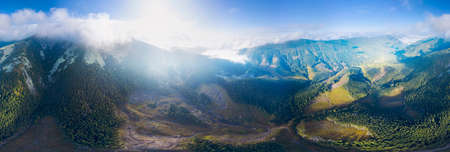 Autumn dawn on Mount Syvuli, Ukraine, a sea of ââfog closes the horizon. A new cloud front has come to the Carpathians - the weather will change. Aerial view drone copterの写真素材